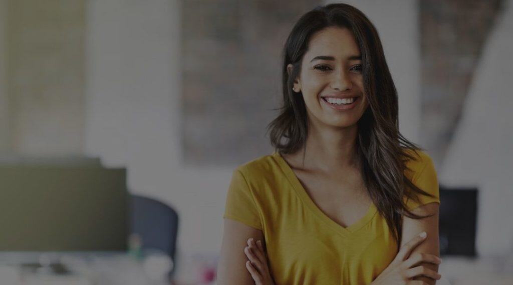 Businesswoman smiling, representing company registration services in India.